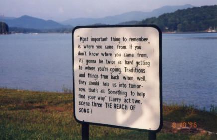 A sign quoting a passage from The Reach of Song